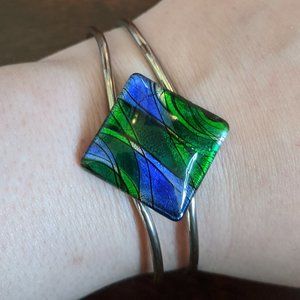 Vintage hinged bracelet with blue & green glass